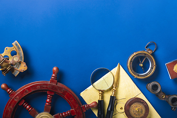 Image showing Old fashioned flat lay with retro accessories on blue background