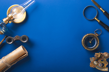 Image showing Old fashioned flat lay with retro accessories on blue background