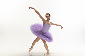 Image showing Young graceful tender ballerina on white studio background