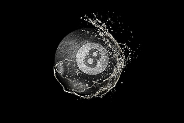 Image showing Billiards ball flying in water drops and splashes isolated on black background