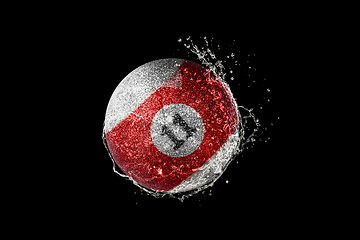 Image showing Billiards ball flying in water drops and splashes isolated on black background