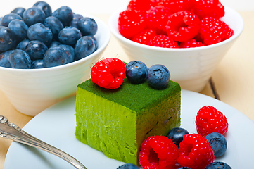 Image showing green tea matcha mousse cake with berries