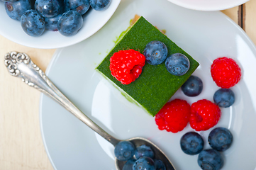 Image showing green tea matcha mousse cake with berries