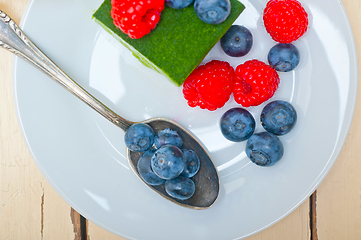 Image showing green tea matcha mousse cake with berries