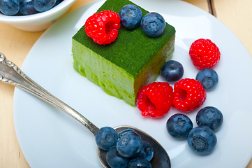 Image showing green tea matcha mousse cake with berries