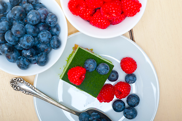 Image showing green tea matcha mousse cake with berries