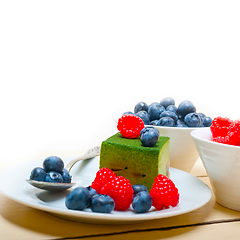 Image showing green tea matcha mousse cake with berries