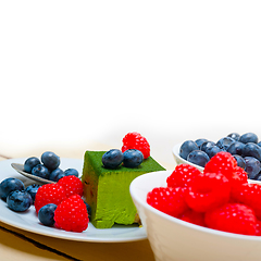 Image showing green tea matcha mousse cake with berries