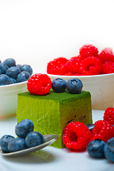 Image showing green tea matcha mousse cake with berries