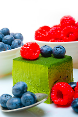 Image showing green tea matcha mousse cake with berries