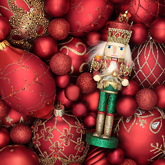 Image showing Festive Christmas Nutcracker Toy Soldier and Sparkling Baubles