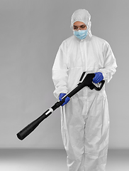 Image showing sanitation worker in hazmat with pressure washer