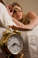 Image showing Shutting off the alarm clock