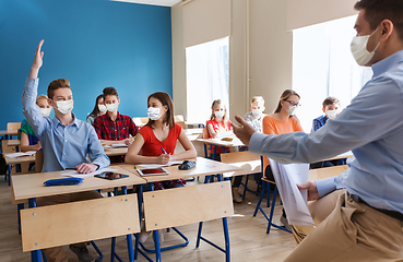 Image showing group of students and teacher in masks at school