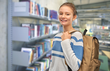 Image showing teenage student girl with school bag at library