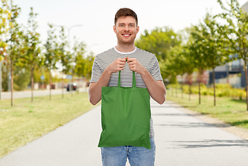 Image showing man with reusable canvas bag for food shopping