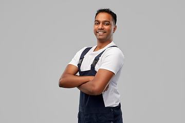 Image showing happy indian worker or builder with crossed arms