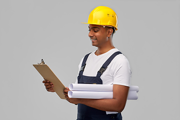 Image showing happy indian builder with blueprint and clipboard