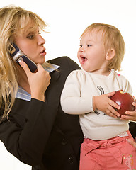 Image showing Working mom with baby