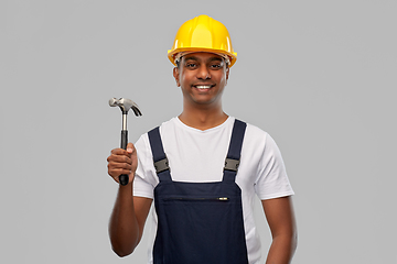 Image showing happy smiling indian worker or builder with hammer