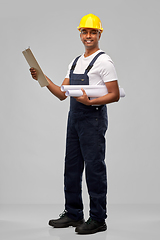 Image showing happy indian builder with blueprint and clipboard