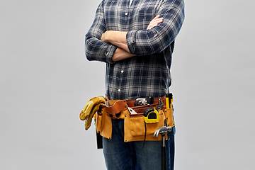 Image showing male worker or builder with working tools on belt