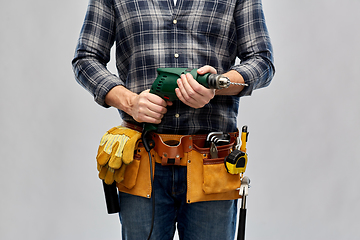 Image showing male repairer or builder with drill and work tools