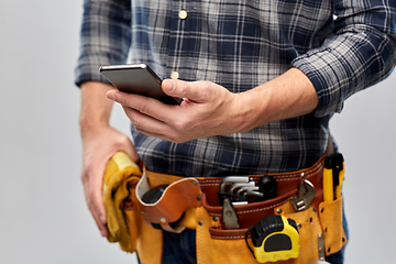 Image showing worker or builder with phone and working tools