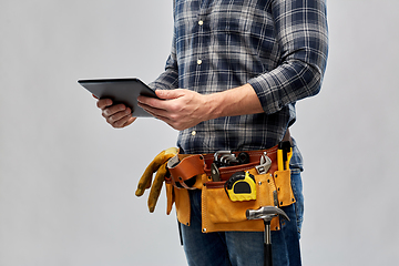 Image showing male builder with tablet pc and working tools