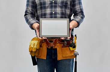 Image showing male builder with working tools showing tablet pc