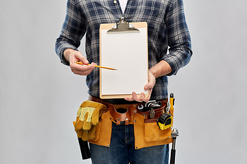 Image showing builder with clipboard, pencil and working tools