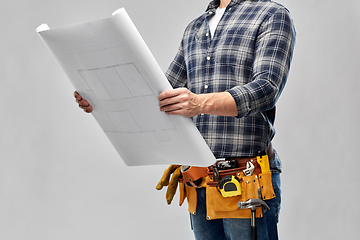 Image showing male builder with blueprint and working tools