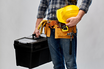 Image showing builder with helmet and box of working tools