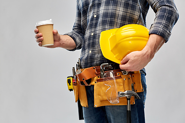 Image showing male builder with coffee, helmet and working tools