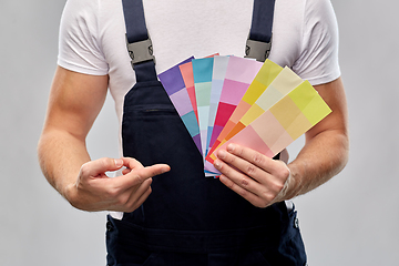 Image showing close up of painter with color charts