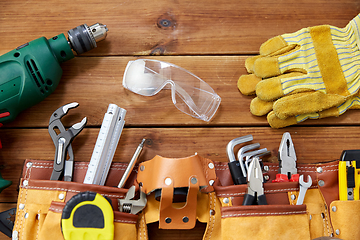 Image showing different work tools on wooden boards