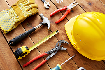 Image showing different work tools on wooden boards