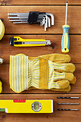 Image showing different work tools on wooden boards