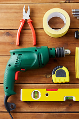 Image showing different work tools on wooden boards