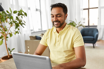 Image showing indian man with laptop working at home office