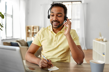 Image showing indian man with headset and laptop working at home