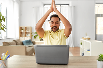 Image showing indian man with laptop working at home office