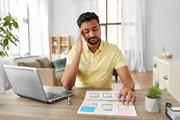 Image showing male ui designer working on user interface at home