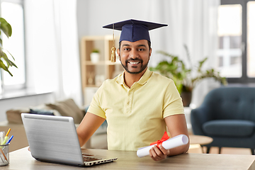 Image showing indian student with laptop and diploma at home