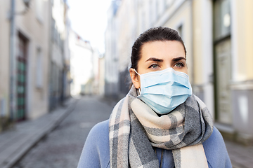 Image showing woman wearing protective medical mask in city