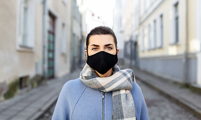 Image showing woman wearing protective reusable mask in city