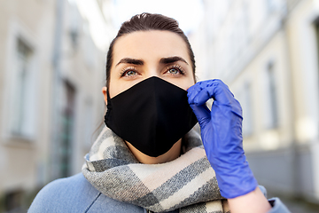 Image showing woman wearing protective reusable mask in city