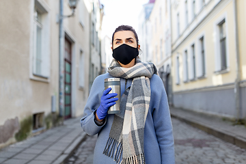 Image showing woman in reusable mask with tumbler in city