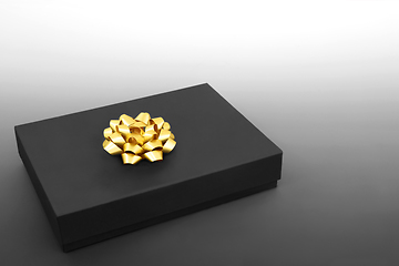 Image showing Elegant Black Gift Box with Gold Bow