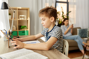 Image showing student boy with tablet computer learning at home